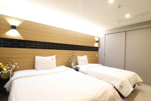 Ένα ή περισσότερα κρεβάτια σε δωμάτιο στο BON Hotel BUSINESS