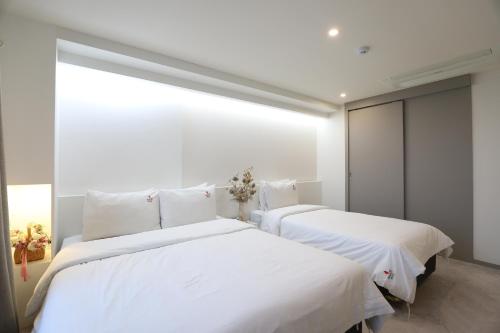 Ένα ή περισσότερα κρεβάτια σε δωμάτιο στο BON Hotel BUSINESS