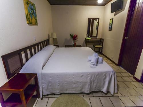 Tempat tidur dalam kamar di Hotel Maribu Caribe