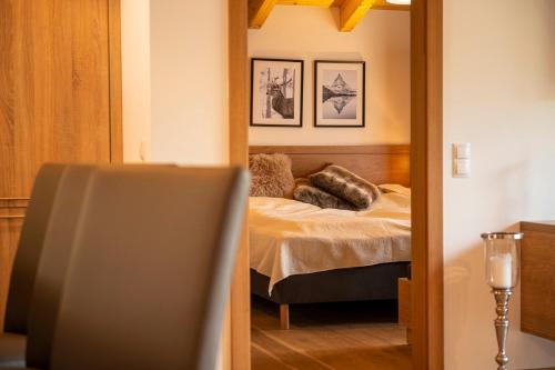Ένα ή περισσότερα κρεβάτια σε δωμάτιο στο Apartment Dorf Wagrain Alpenleben by AlpenTravel