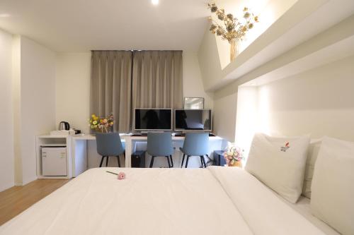 Ένα ή περισσότερα κρεβάτια σε δωμάτιο στο BON Hotel BUSINESS