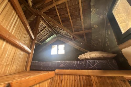 an inside view of a room in a tree house at Lover's Point Beach Front Resort in Lian