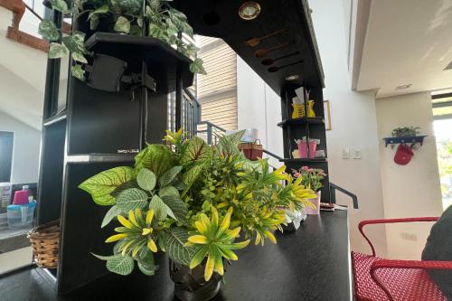 a kitchen with a bunch of flowers in a stove at Lover's Point Beach Front Resort in Lian
