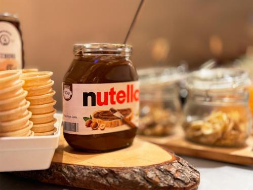 a jar of nutella next to a plate of food at Grimm's Berlin Mitte in Berlin