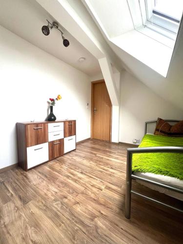 a bedroom with a bed and a skylight at Ferienwohnung in Bietikow 