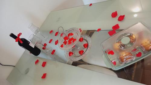a room filled with red hearts on a table at Regina del Porto in Brindisi