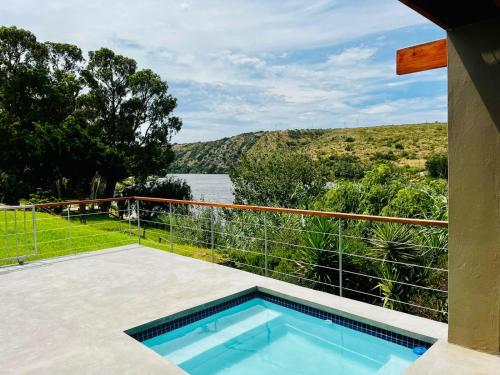 a swimming pool on the balcony of a house at Malgas 168 - Kom Binne Home in Malgas