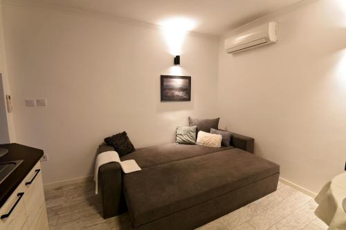 a living room with a couch in a room at Sea apartment / Апартамент до морето in Varna City
