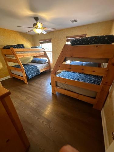 a room with two bunk beds and a ceiling at Poconos Lake harmony Jackfrost ski Pocono Raceway Camelback ski Mount Airy Lodge in Albrightsville