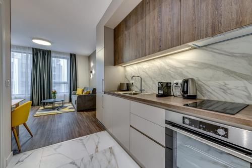 a kitchen with a sink and a counter top at Mona Living in Sofia