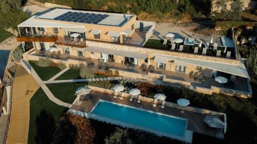 an aerial view of a house with a swimming pool at Apartments Monsurei, Lake view in Bardolino