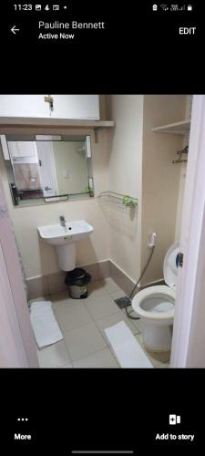 a bathroom with a sink and a toilet at Sarado do not book here please in Cebu City