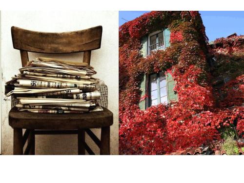 a stack of papers on a chair next to a window at Pescallo Apartments in Bellagio