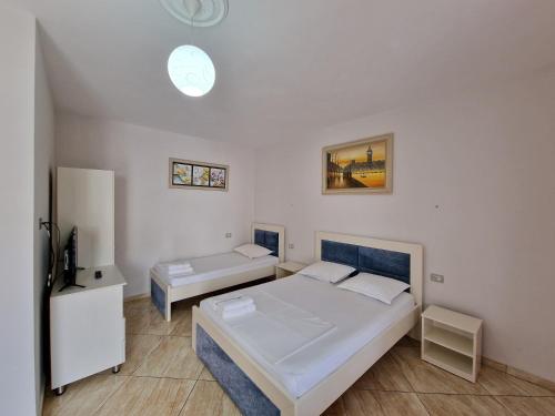 Postel nebo postele na pokoji v ubytování Hotel Fabio