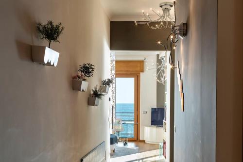a hallway with a room with a view of the ocean at Salerno e Costiera Amalfitana al Top in Salerno