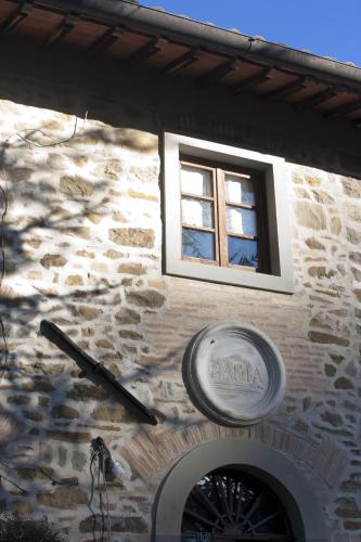 a window on the side of a stone building at Podere Badia Valdrago Agriturismo Mugello Circuit in Scarperia