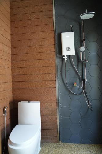 a bathroom with a toilet and a shower at One Beach Resort By EHM in Koh Rong Sanloem