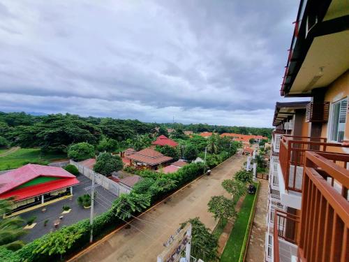 a view from a balcony of a building with a street at Palawan Luxury Stay with Balcony, Free Gym & Pool - B1 5Topaz in Puerto Princesa City