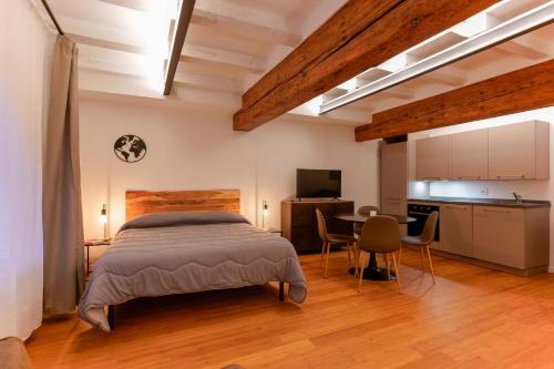 Ένα ή περισσότερα κρεβάτια σε δωμάτιο στο Sette Chiese Apartments