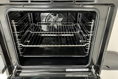 an oven with its door open with a fan inside at Neue Wohnung für 4 Küche Terrasse in Wittlich