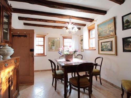 a dining room with a table and chairs at Retreat in the Dolomites in Chies dʼAlpago