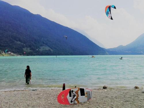 a person standing on a beach flying a kite at Retreat in the Dolomites in Chies dʼAlpago