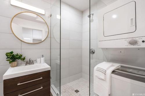 a bathroom with a shower and a sink and a mirror at Charming apt in Pacific Heights in San Francisco