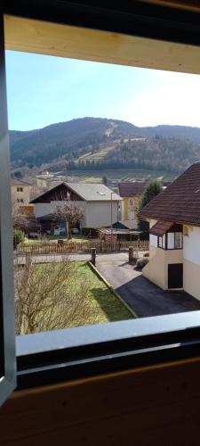 a view from a window of a house at Chalet le p'ti lu in Bussang