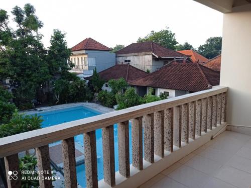 a view of the pool from the balcony at Spacious Room Jimbaran in Jimbaran