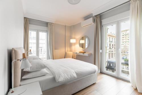 A bed or beds in a room at Eclair by halu! Apartments