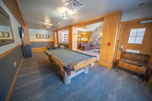 a room with a pool table in a house at Expedition Station 8597 in Keystone