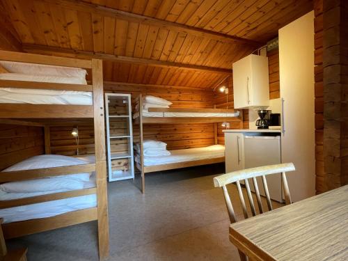 a room with bunk beds in a cabin at Urshult Camping in Urshult
