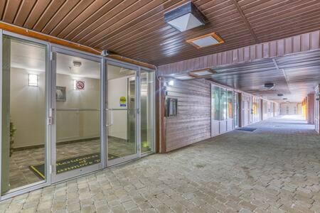 een lege kamer met glazen deuren in een gebouw bij Best Views of Canmore - 2Bed 2Bath in Canmore