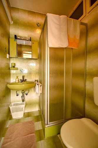 a bathroom with a sink and a toilet at Rooms Anđela in Rab