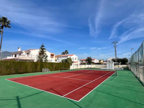 a tennis court with a net on top of it at La Villa in Benicàssim