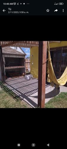 a picture of a porch with a hammock at Lo de Yamaha in Aguas Dulces