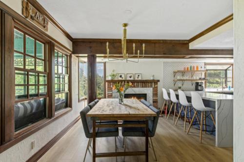 a dining room and kitchen with a table and chairs at Lake Reflection Point Upscale Lake House 4 Bed and 4.5 Bath in Lake Arrowhead