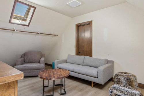 a living room with a couch and a chair at Lake Reflection Point Upscale Lake House 4 Bed and 4.5 Bath in Lake Arrowhead