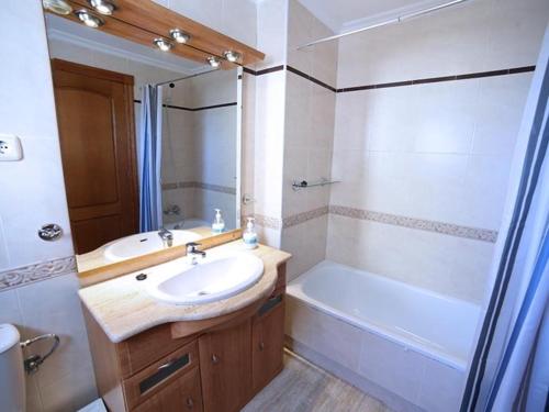 a bathroom with a sink and a toilet and a tub at Las Velas F in La Manga del Mar Menor