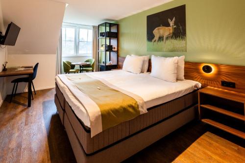 Landhuis Hotel de Herikerbergにあるベッド