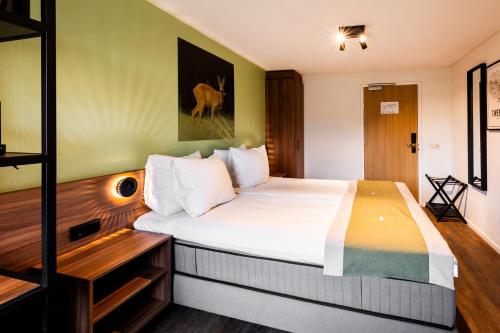 Landhuis Hotel de Herikerbergにあるベッド