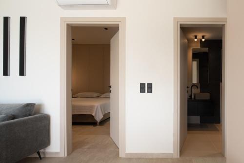 a room with a door leading to a bedroom at Cueva Villas, with Pool, SeaViews & close to Sea, By ThinkVilla in Balíon