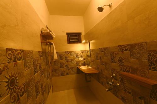a bathroom with a sink and a toilet at KACHINS Homes in Coonoor
