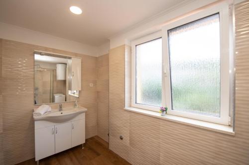 a bathroom with a sink and a window at Apartment in Ika with Seaview, Balcony, Air condition, WIFI 5025-4 in Ika