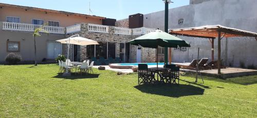 Πισίνα στο ή κοντά στο Quinta barrio cerrado pileta tranquilidad naturaleza