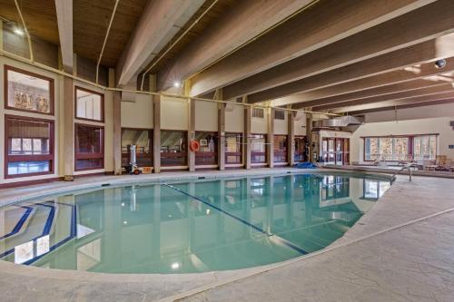 a large swimming pool in a large building at Ski Home on Bell Valley in Campton