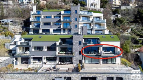 an aerial view of a building with a red circle on it at THE VIEW!!! by Design Studio in Perledo