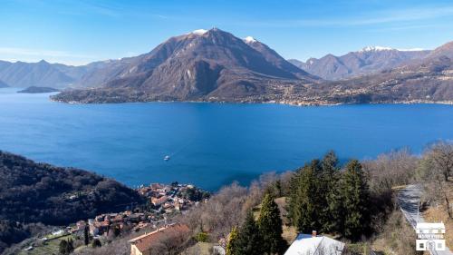 a view of a lake with a mountain at THE VIEW!!! by Design Studio in Perledo