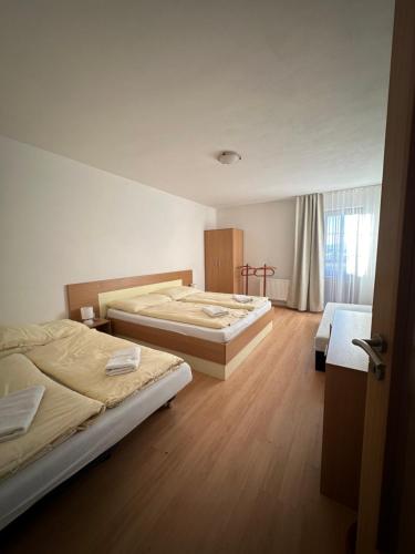 Postel nebo postele na pokoji v ubytování Apartmány Telgárt