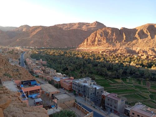an aerial view of a city with mountains in the background at Auberge ALI Todra A Natural Oasis in Tinerhir